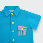 Blue shirt with colorful buttons and a striped pocket on a white background