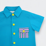 Blue shirt with colorful buttons and a striped pocket on a white background