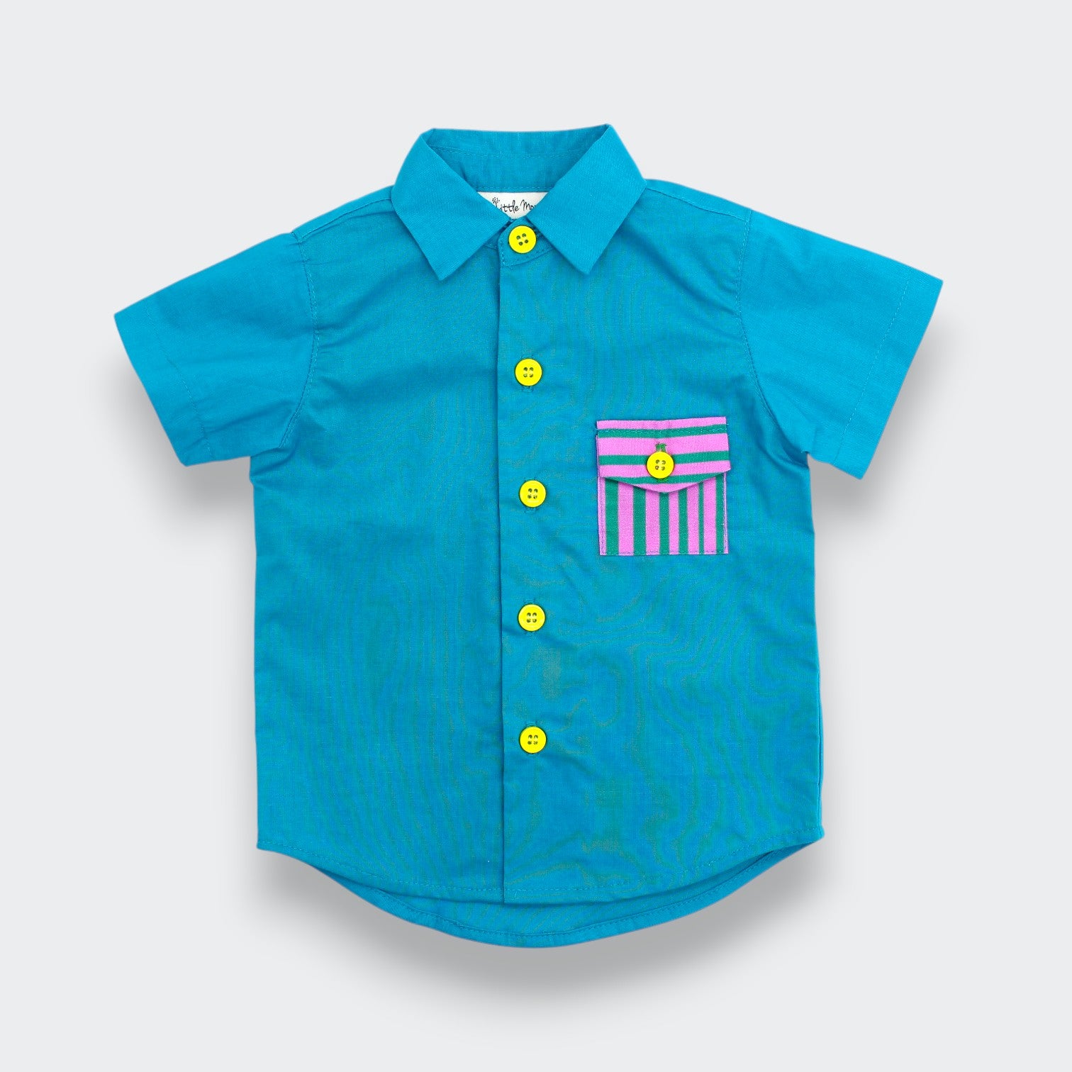Little  Moony blue teal cotton button up baby and toddler shirt with yellow buttons and striped pink and green chest pocket flat lay view