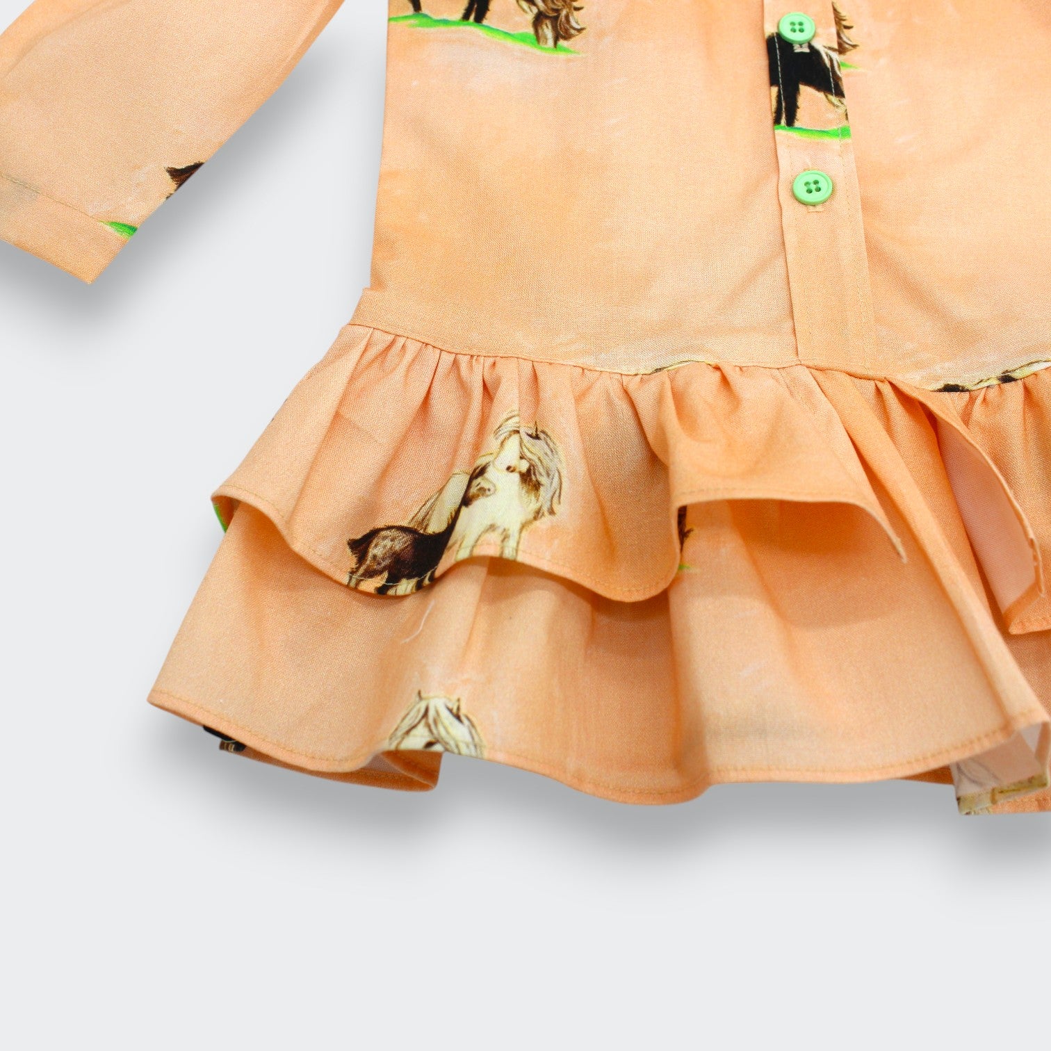 Close-up of playful horse print and contrast buttons on Little Moony