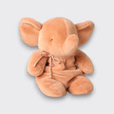 Vintage rose elephant plush toy with large ears, a curled trunk, and a matching neck bow on a light gray background.