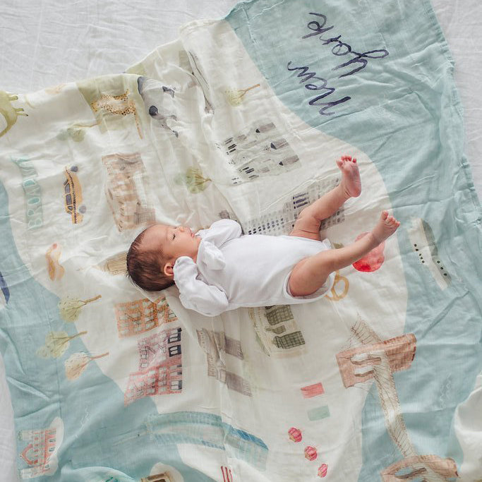 Baby on Little Moony New York City Soft and Breathable Muslin Swaddle Blanket