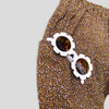 Cotton Golden Brown and Yellow Petite Fleur Harem Pants for Babies and Kids. Curated look with White Daisy Sunglasses (not included). Detail view.