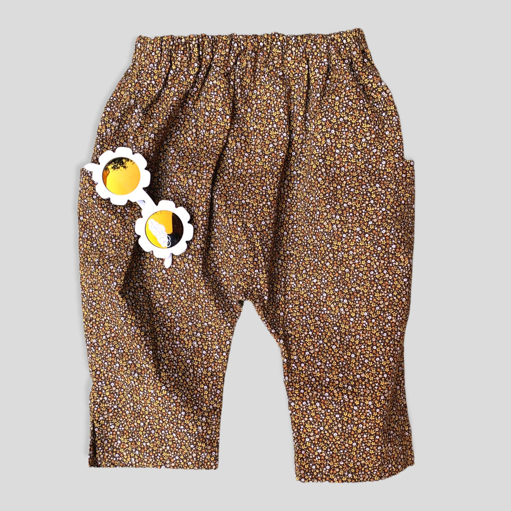 Cotton Golden Brown and Yellow Petite Fleur Harem Pants for Babies and Kids. Curated look with White Daisy Sunglasses (not included).